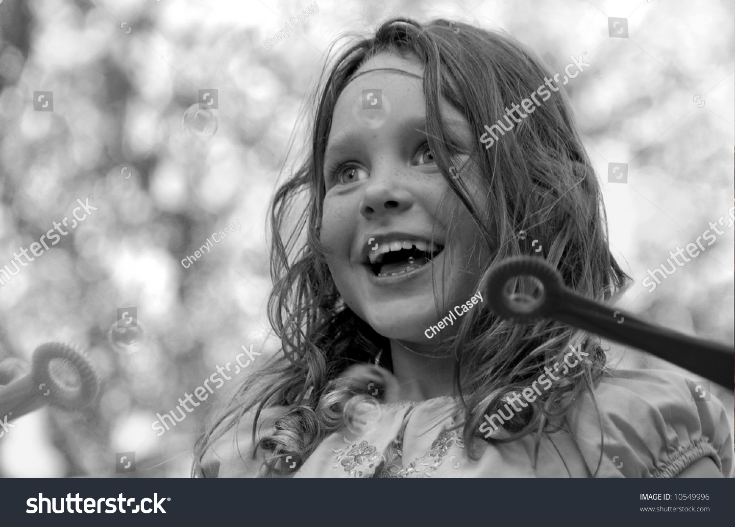 Cute Young Girl Blowing Bubbles Outside Stock Photo 10549996 Shutterstock