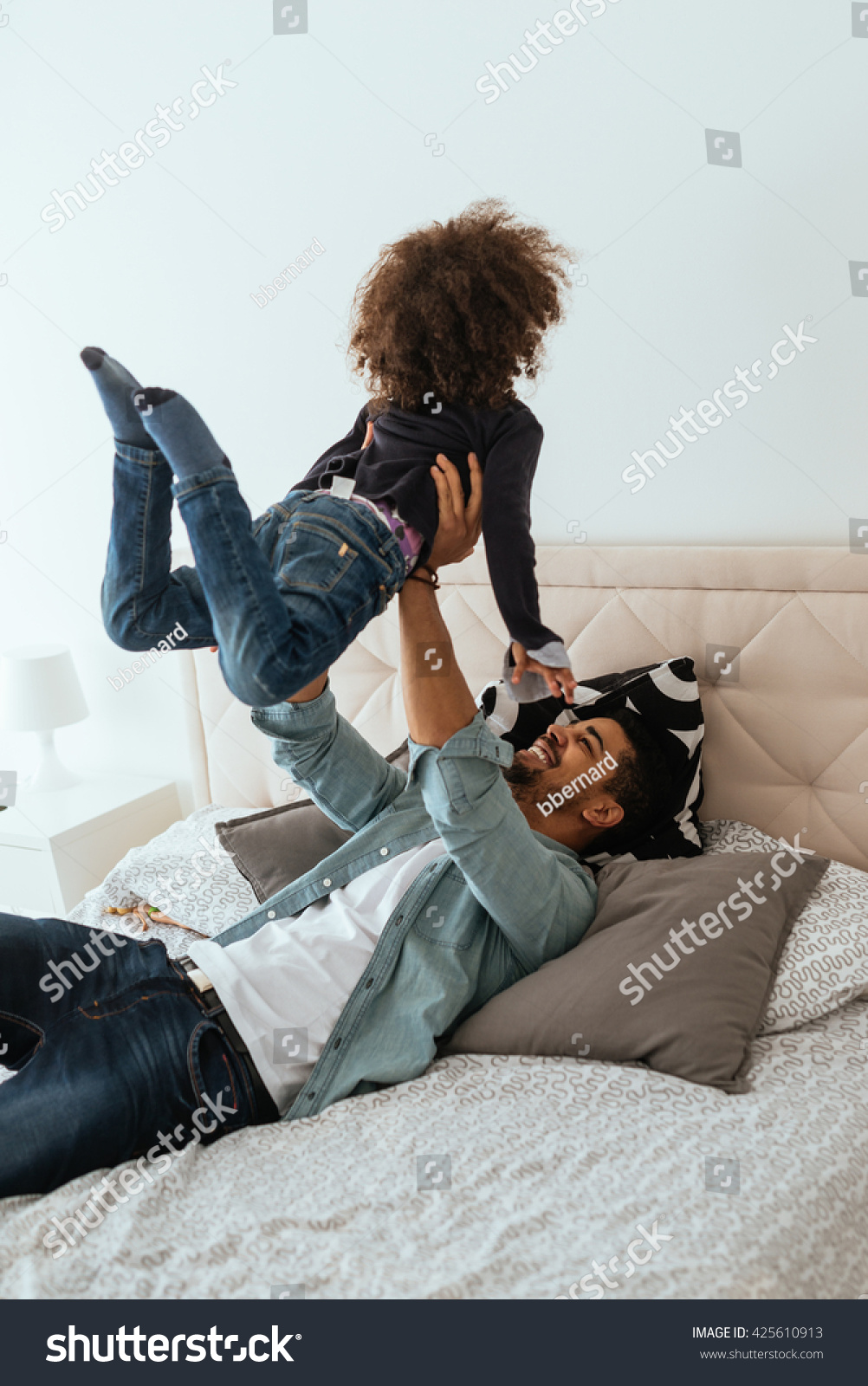 Dad and his girl playing in the bed Dad and his girl playing in the bed