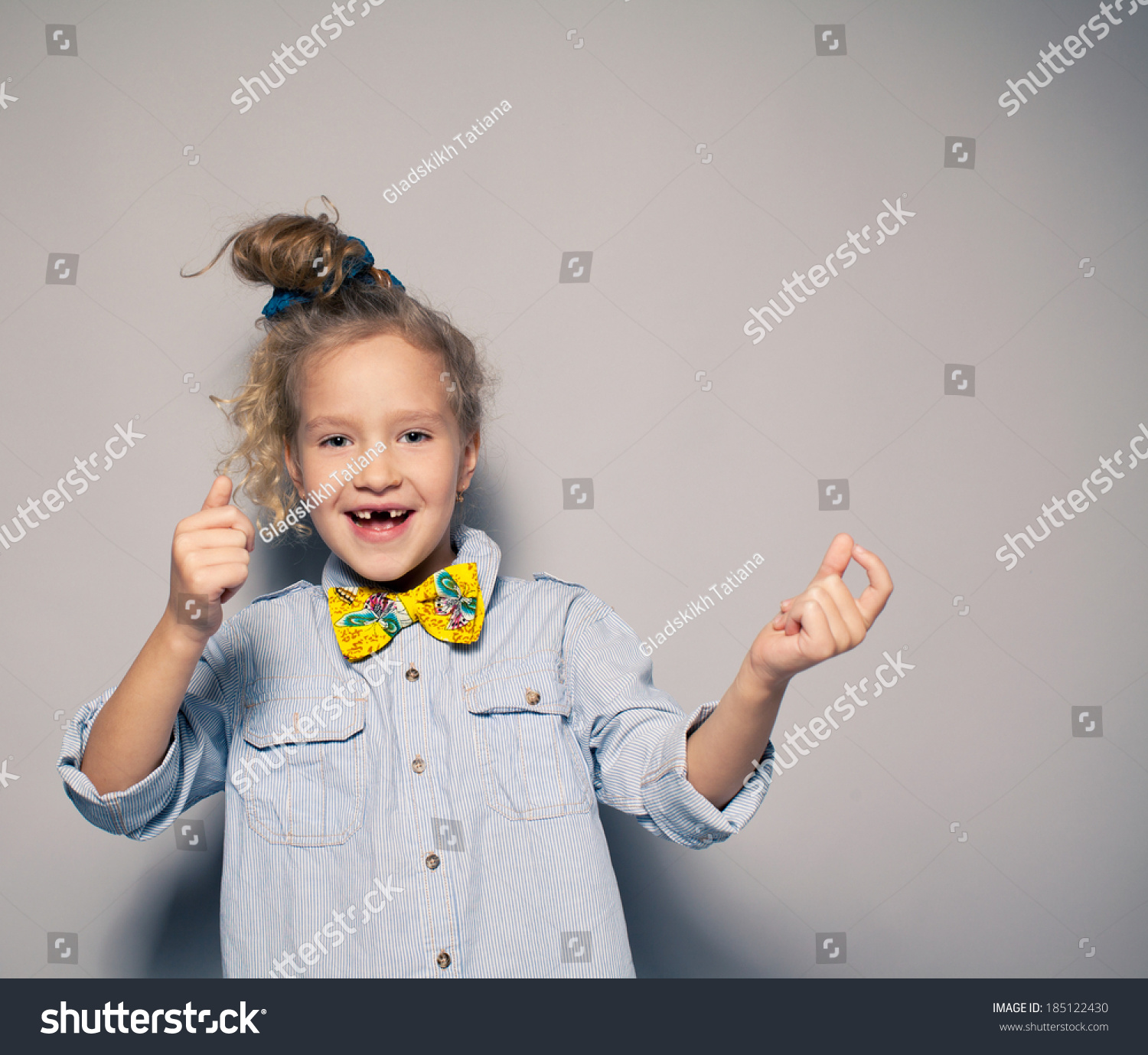 Dansing child Motions fashion girl studio shot Dansing child Motions fashion girl studio shot