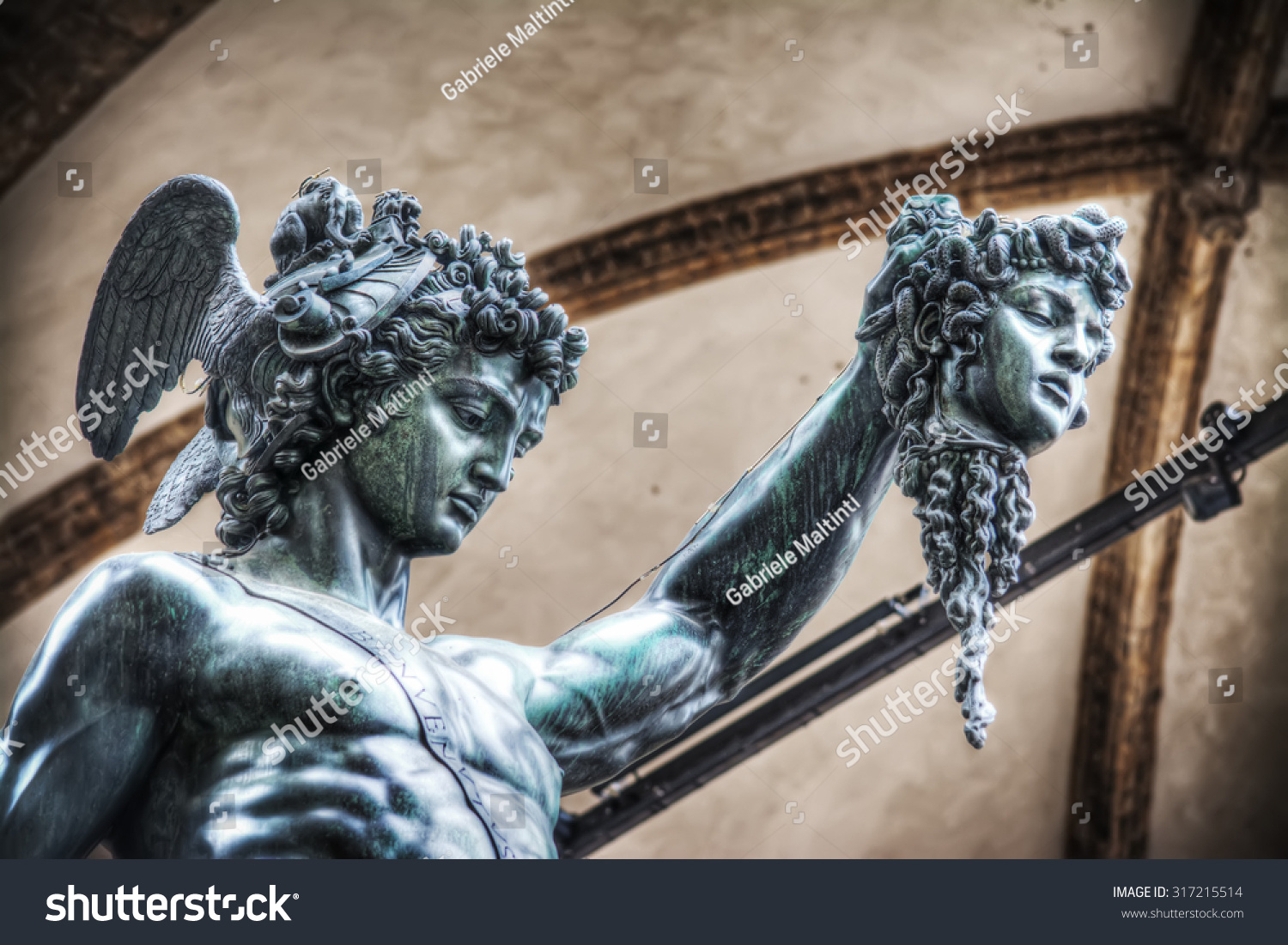 medusa statue holding head