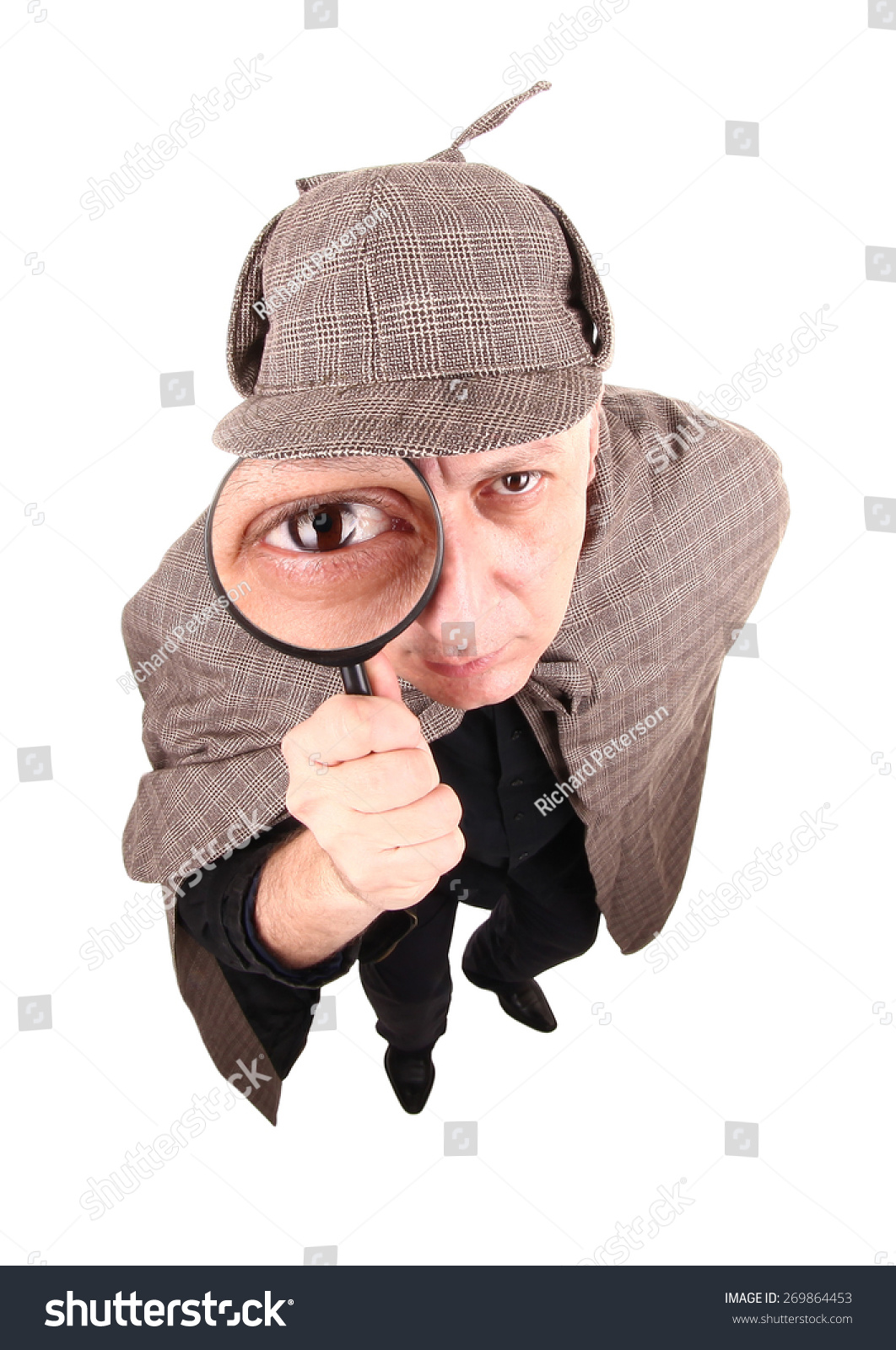 Detective Investigates With Magnifying Glass Stock Photo 269864453 