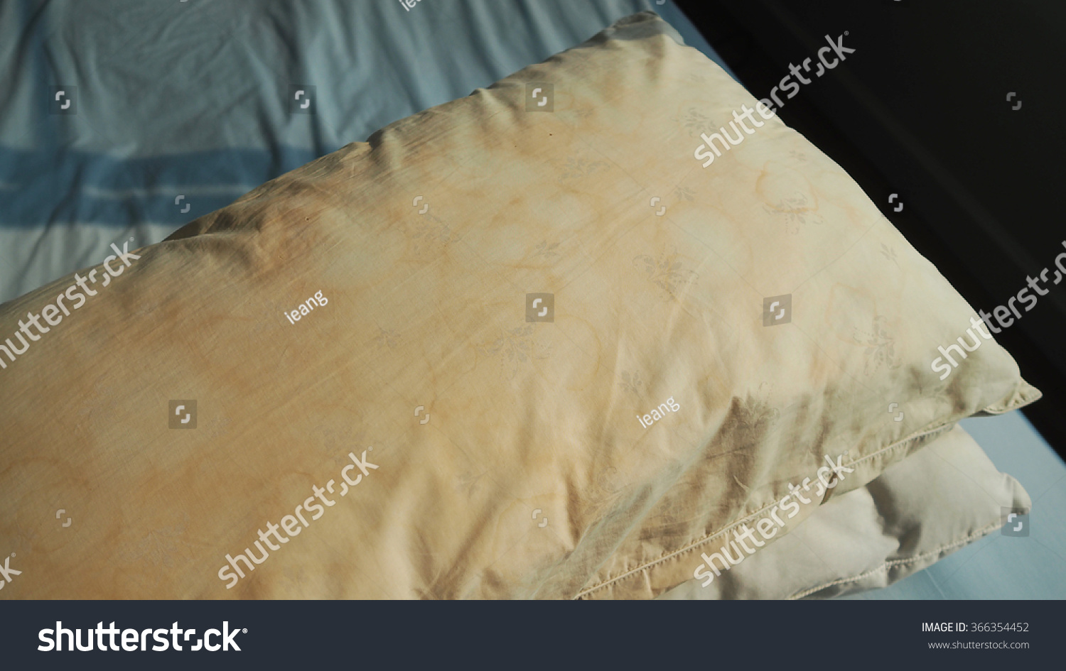 Dirty Pillow From Saliva Stain On The Bed. Dirty Pillow With Pale