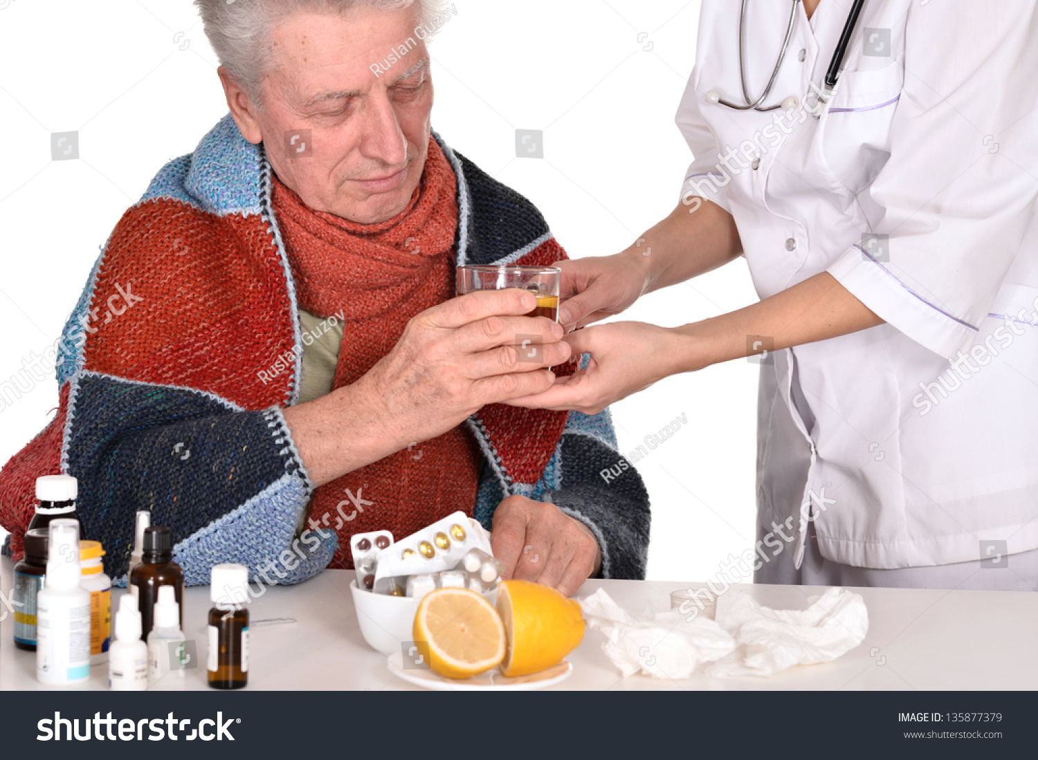 doctor-treats-sick-elderly-man-over-a-white-background-stock-photo