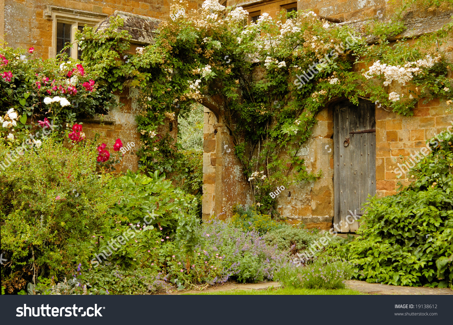 Door Into The Garden Into Medieval Castle In England In Summer Day