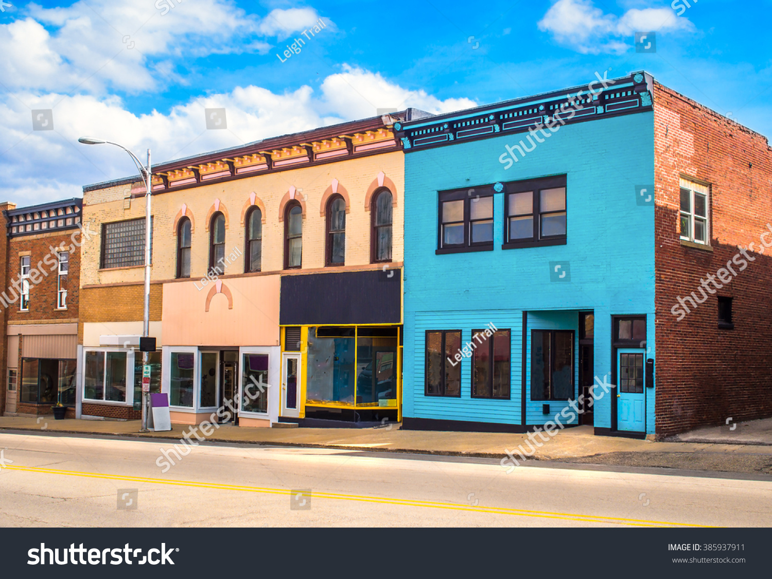 downtown-main-street-business-storefronts-stock-photo-385937911