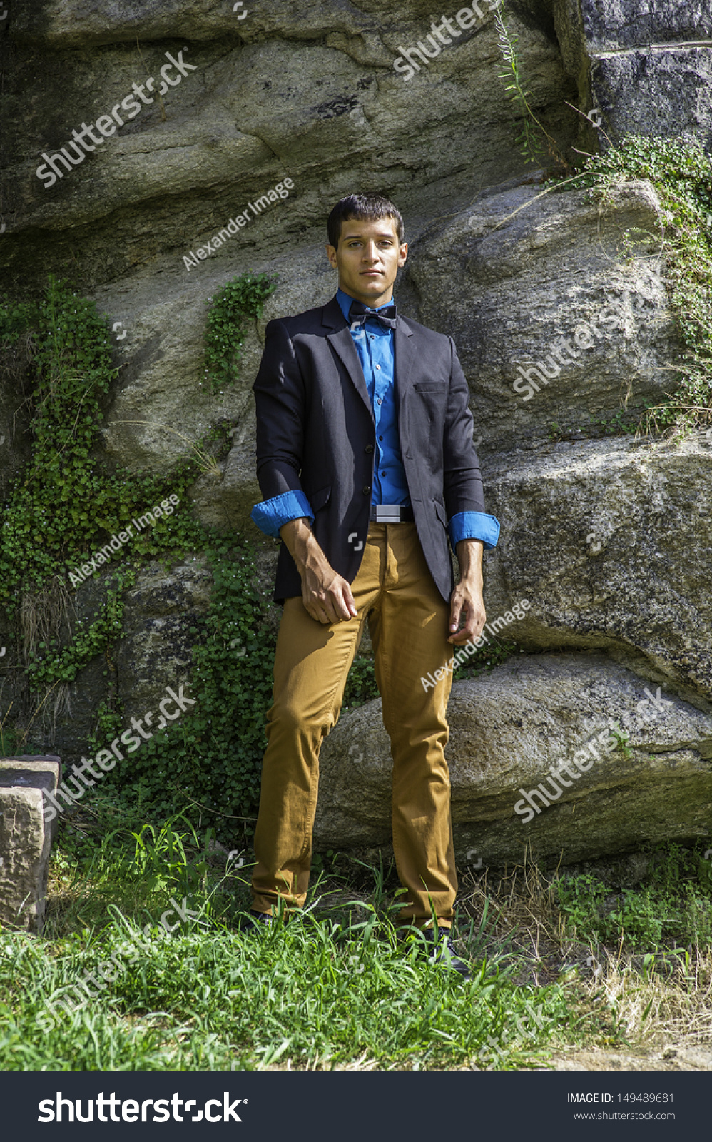 blue shirt with brown pants