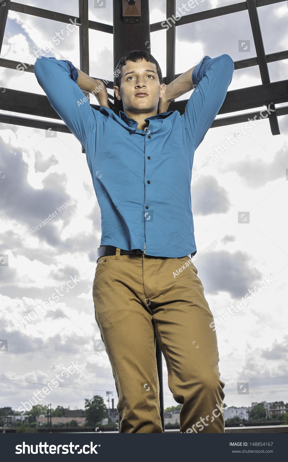 blue shirt with brown pants