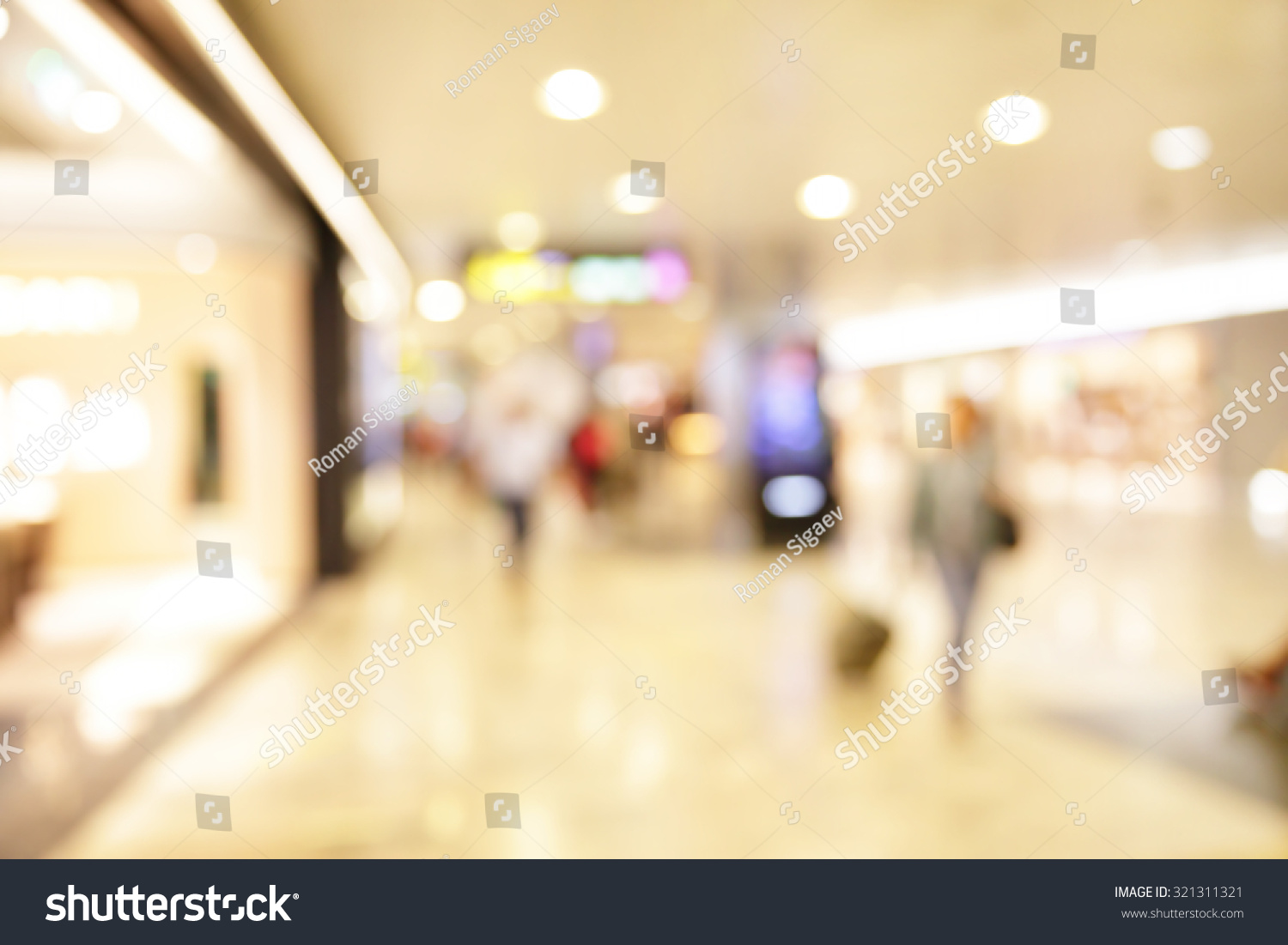 Duty free shop windows in airport defocused blured background Duty free shop windows in airport defocused blured background