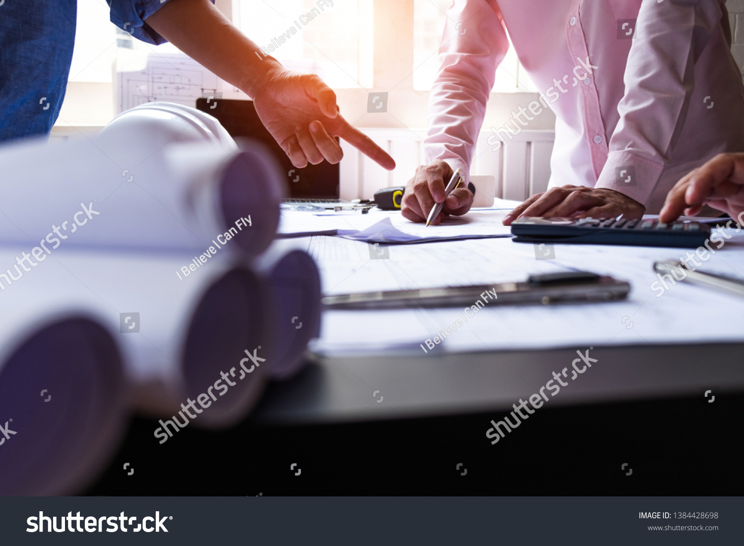 Engineers Pointing Building On Blueprint Using Stock Photo 1384428698