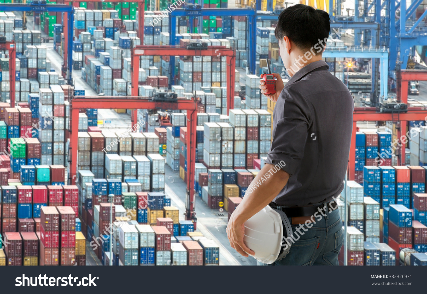 Engineers use radio order are working on a container yard Shipping port Engineers use radio order are working on a container yard Shipping port