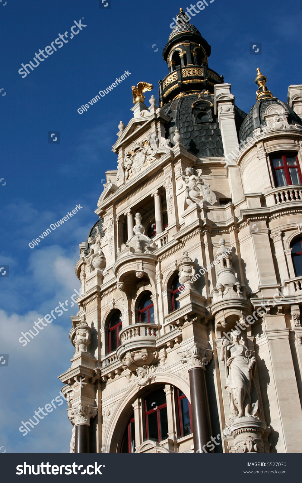 Facade Of Old Building In Europe, Richly Decorated With Gold, Statues ...