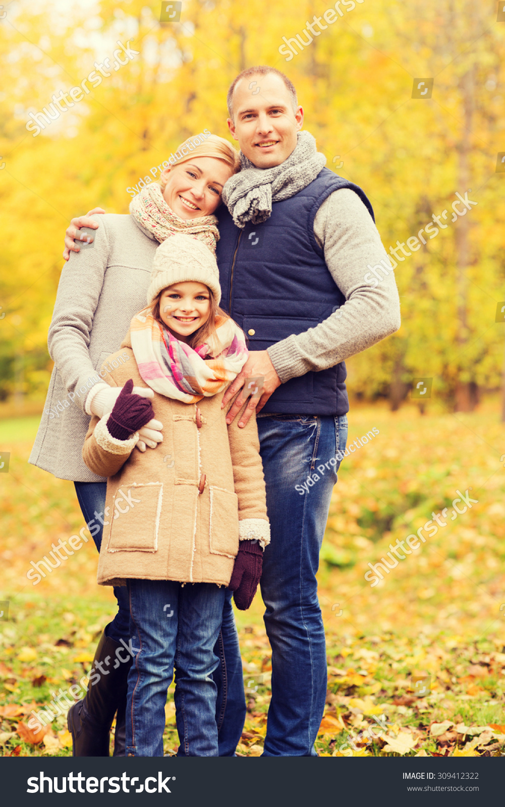 family childhood season and people concept happy family in autumn park family childhood season and people concept happy family in autumn park