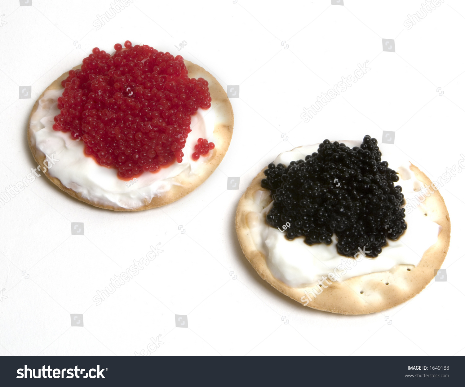 Fancy Black And Red Caviar With Sour Cream On Top Of Crackers Stock