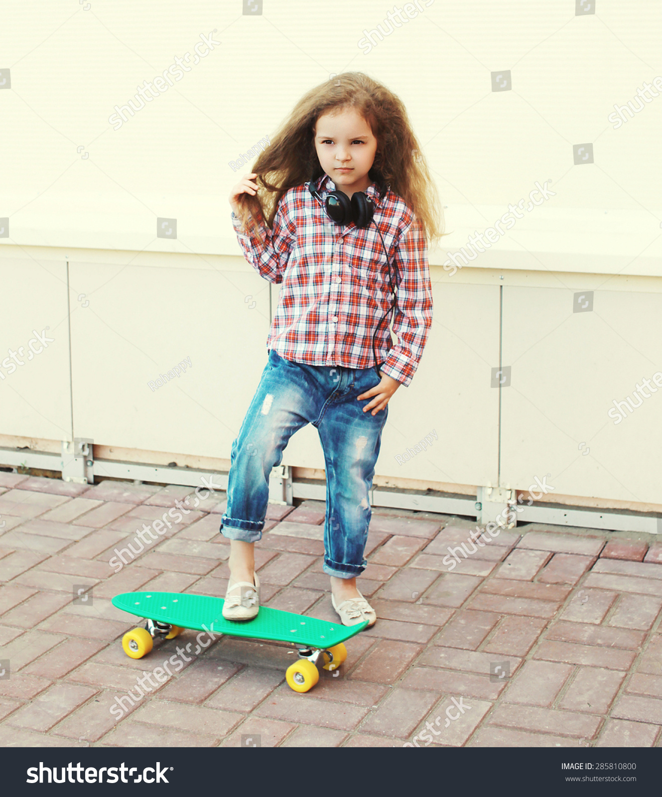 Fashion Kid Concept - Stylish Little Girl Child With Skateboard Having