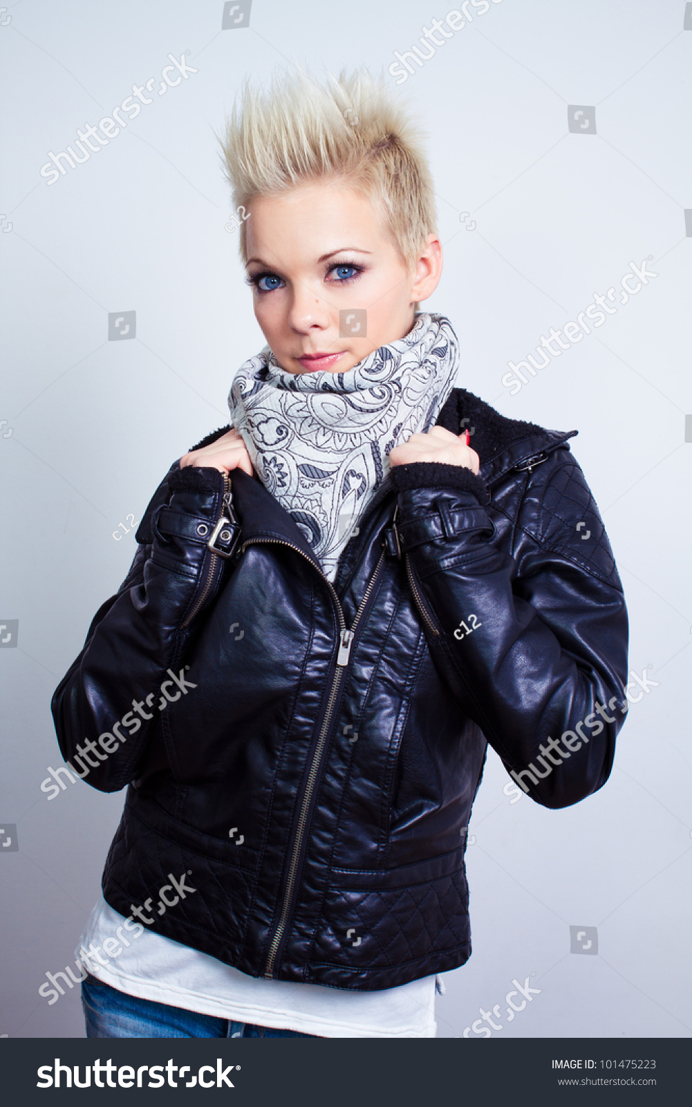 Fashion Model Woman Wearing Scarf And Black Leather Jacket On Gray