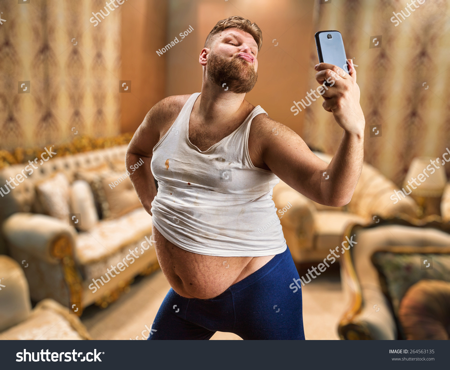 Fat Glamour Man With Beard Takes Selfie In His Bedroom