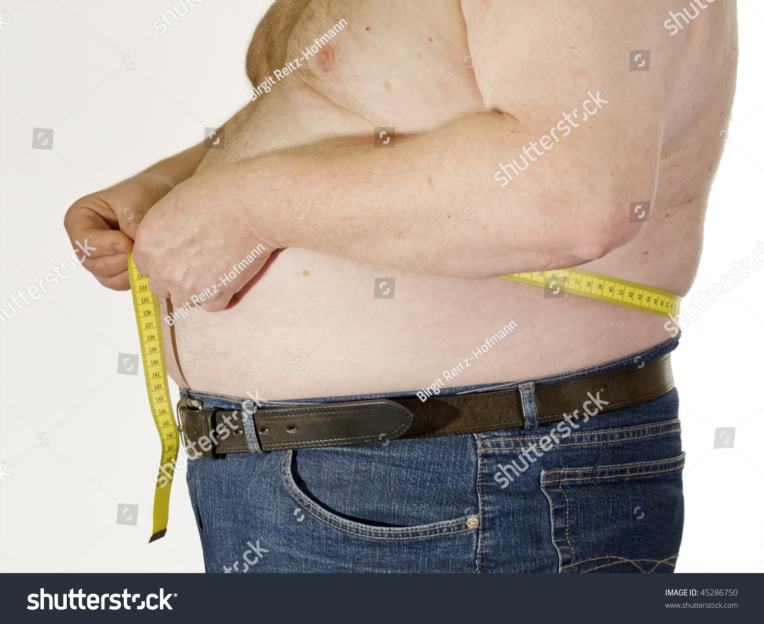 Fat Man With No Shirt And His Belly Hanging Over His Pants Stock Photo