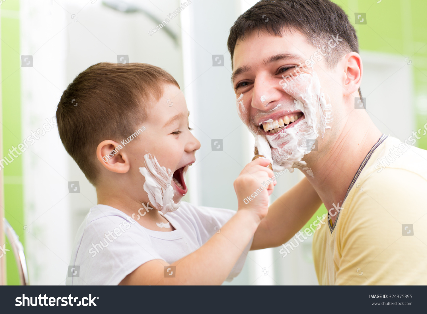 Father And His Kid Son Playing In Bathroom Child Boy Putting Shavin