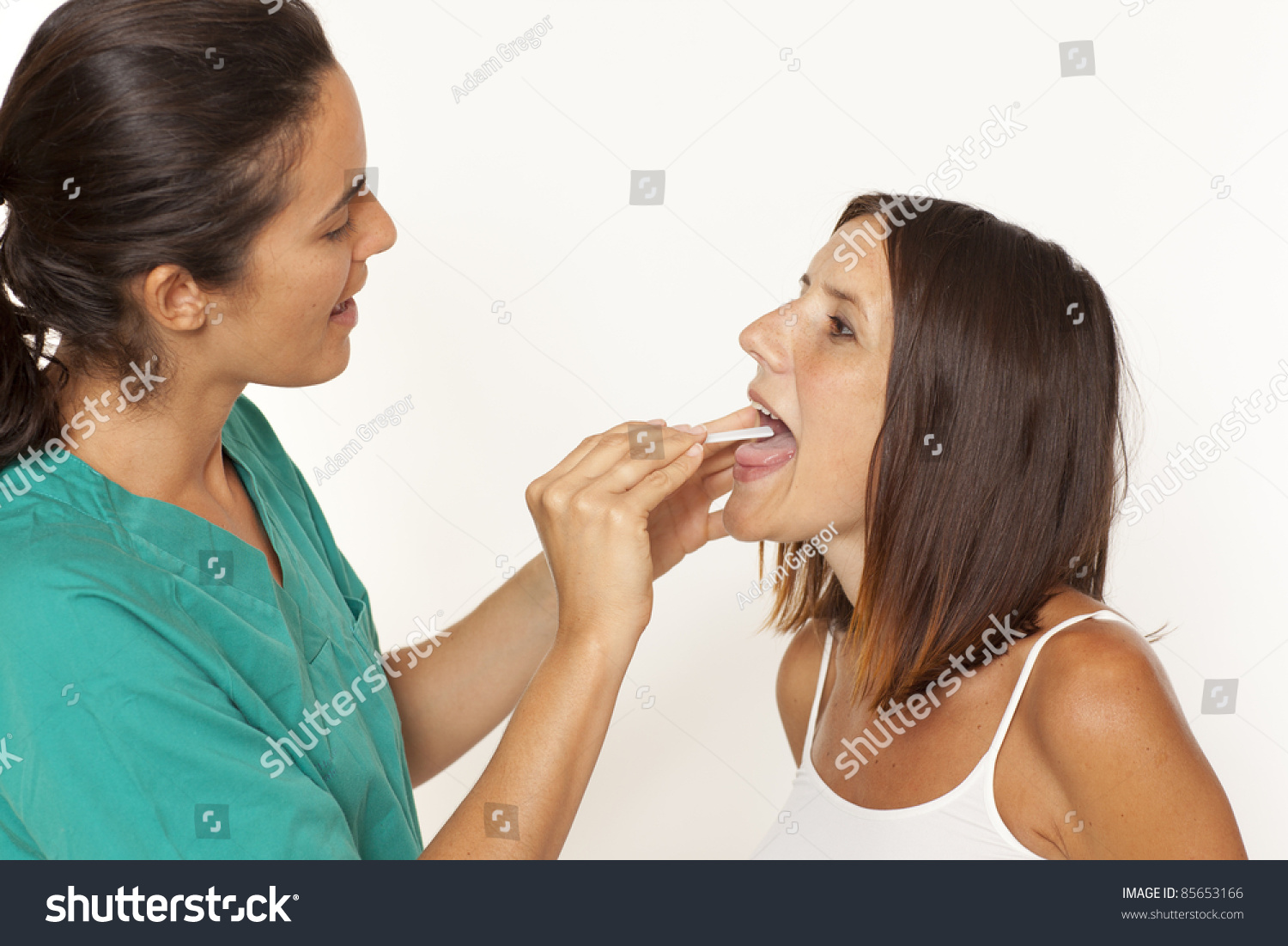 Female Doctor Checking For Sore Throat Stock Photo 85653166 : Shutterstock