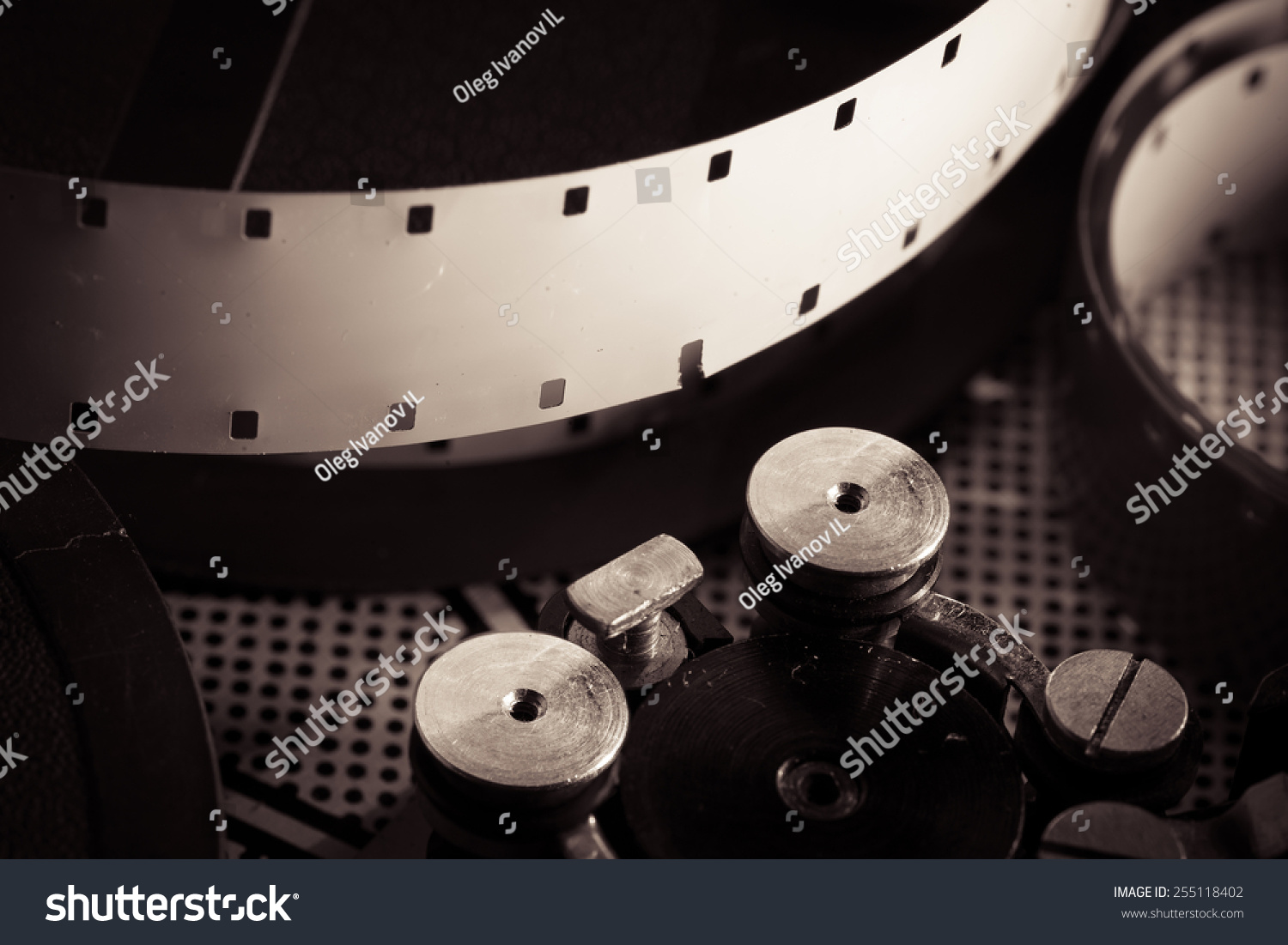 film-reel-inside-oldfashioned-retro-movie-stock-photo-255118402