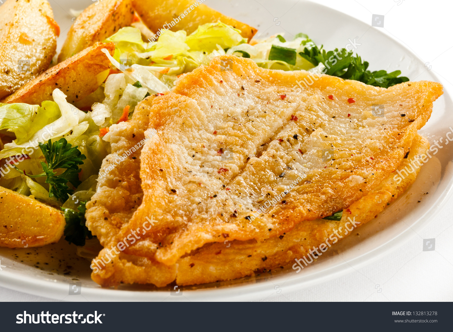Fish Dish - Fried Fish Fillets, Baked Potatoes And Vegetable Salad