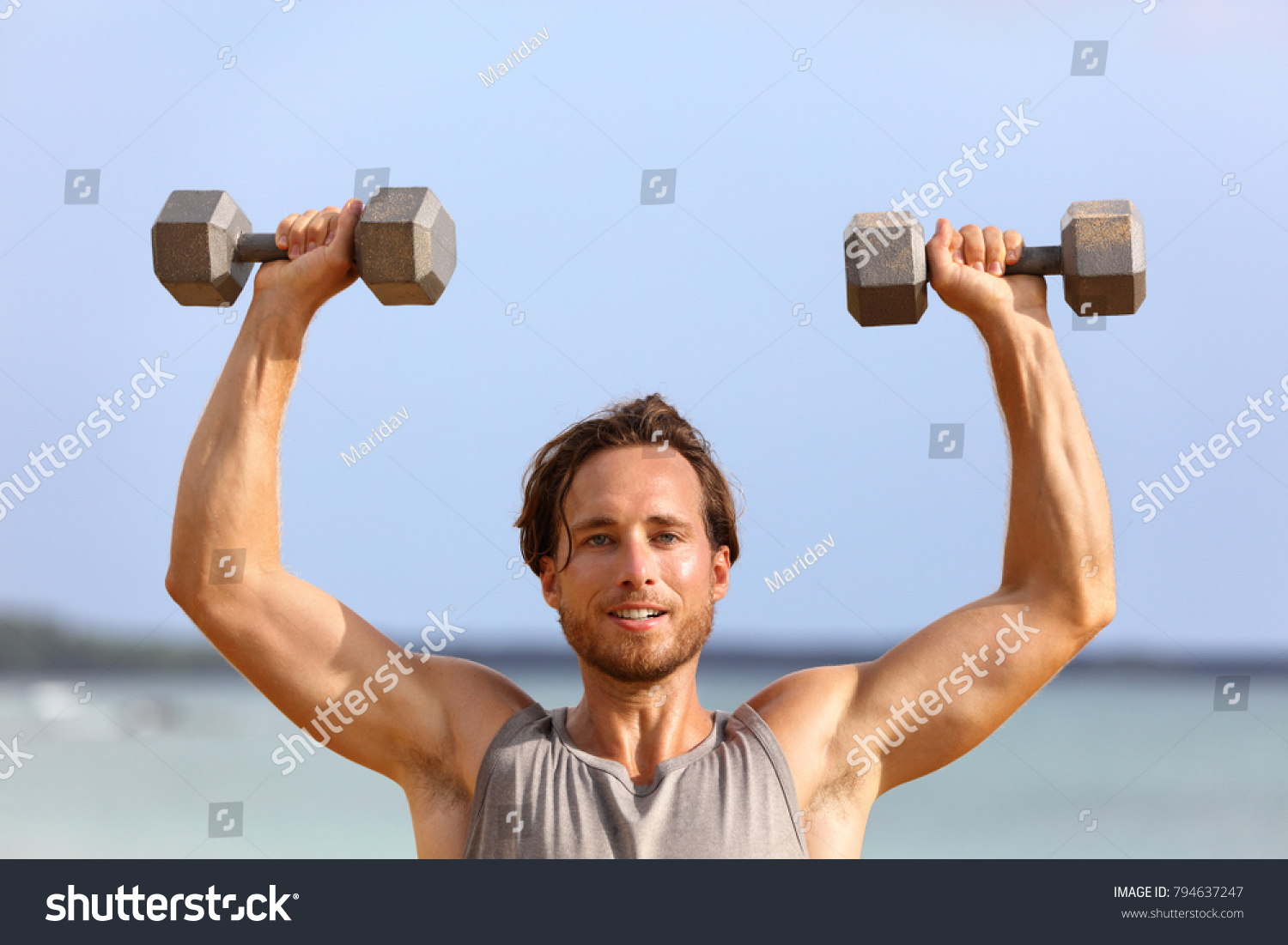 Fitness Gym Man Lifting Dumbbell Weights Stock Photo