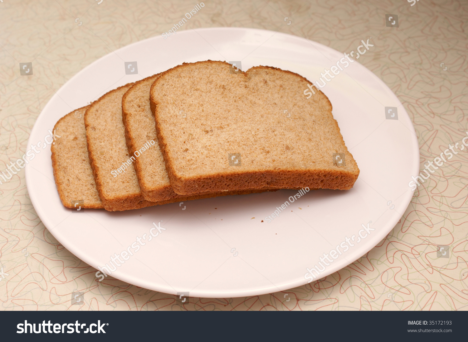 four-slices-of-whole-grain-wheat-bread-on-a-plate-sitting-on-old