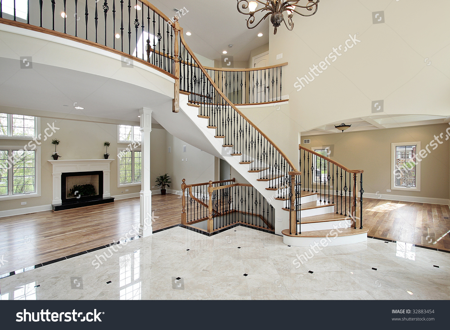 Foyer with curved staircase in luxury home stock photo 32883454 ...
