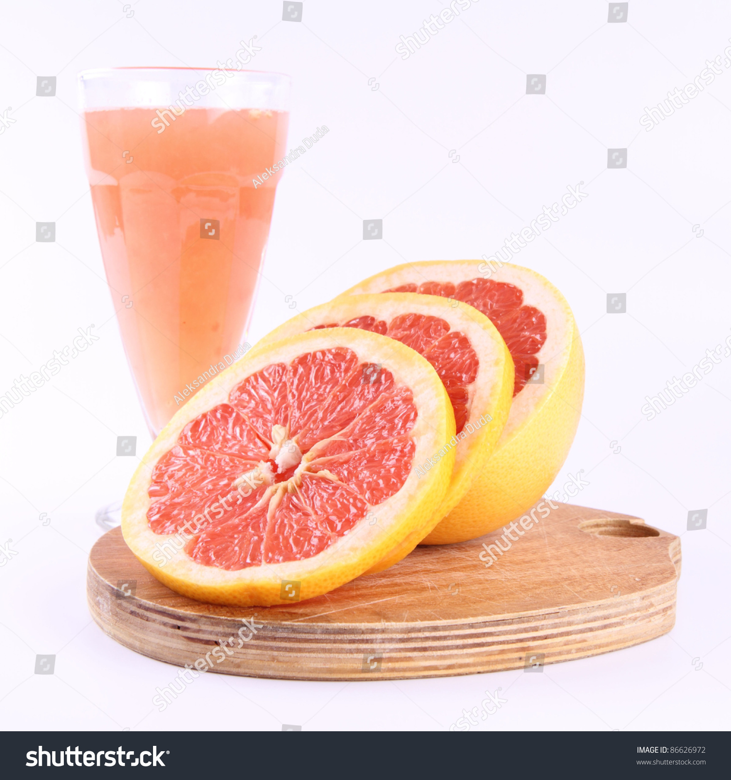 Freshly Squeezed Out Grapefruit Juice, And A Sliced Grapefruit Stock Photo 86626972 Shutterstock