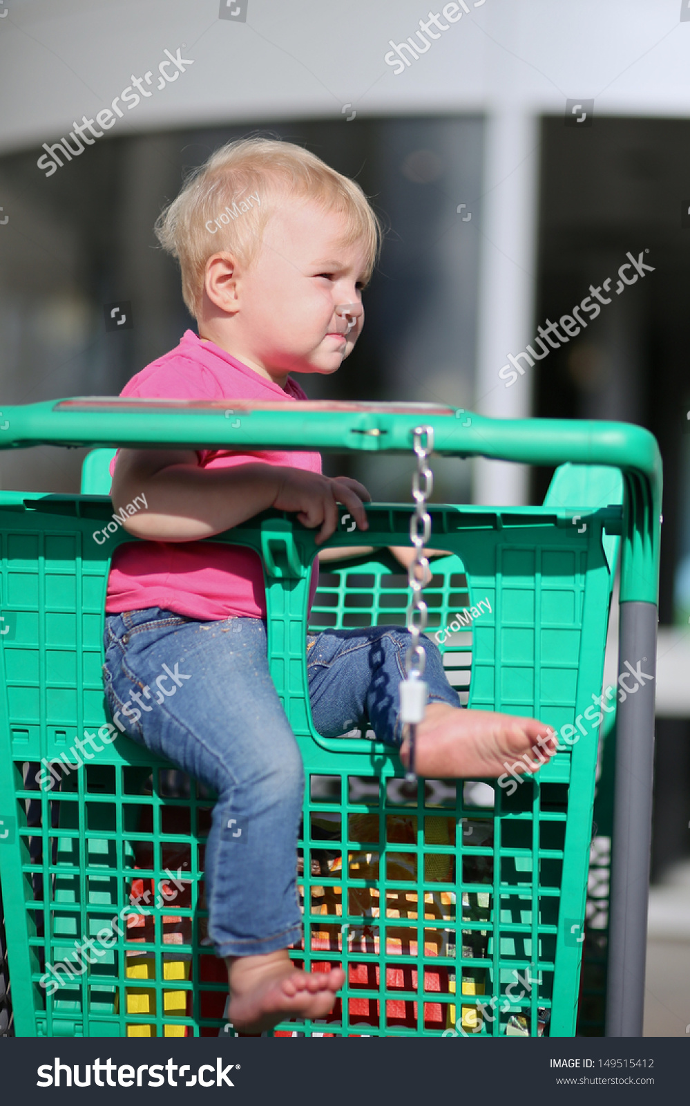 child in shopping trolley