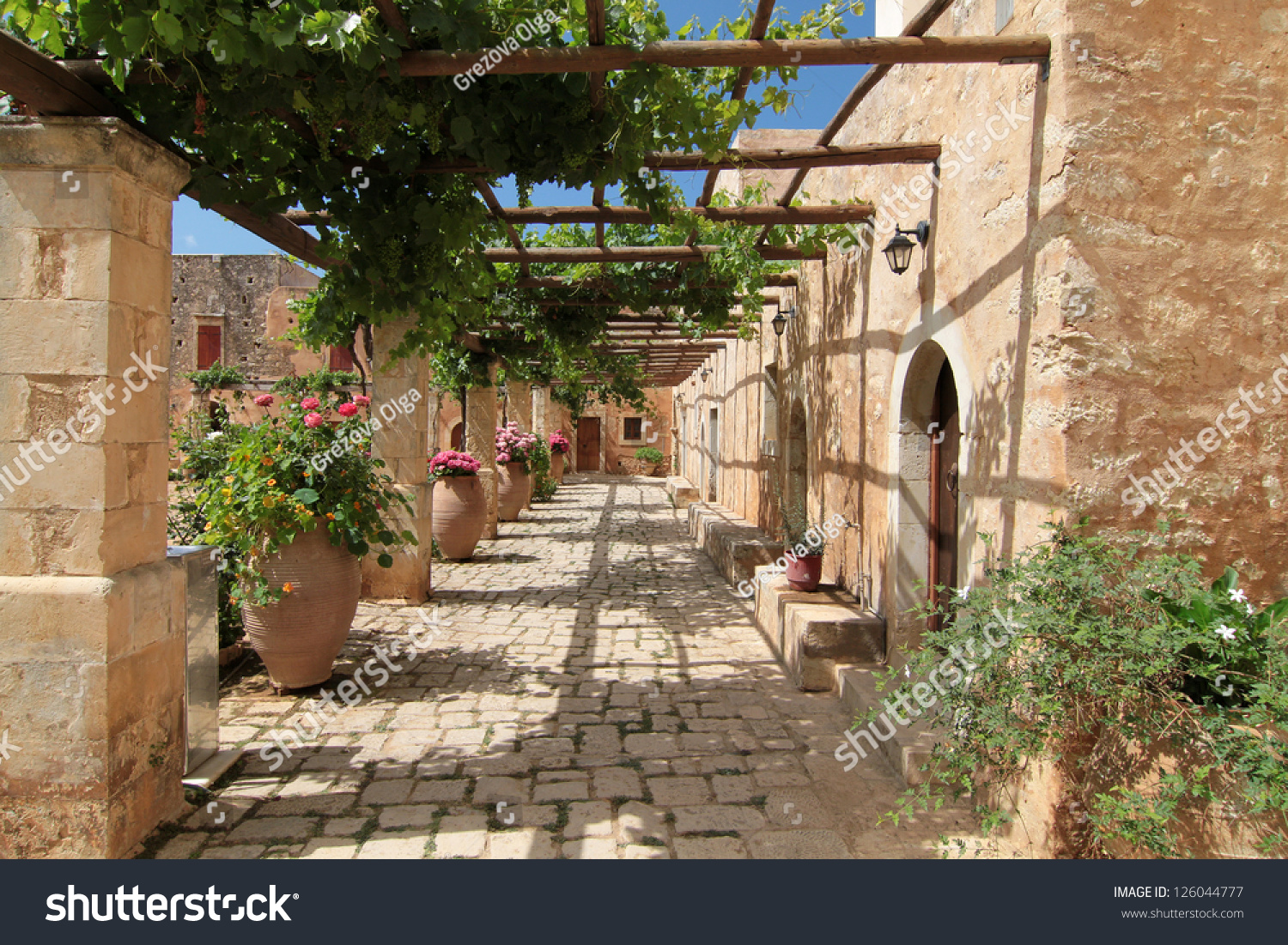Garden Courtyard With Flowers In Ceramic Pots, Images From Monastery Of