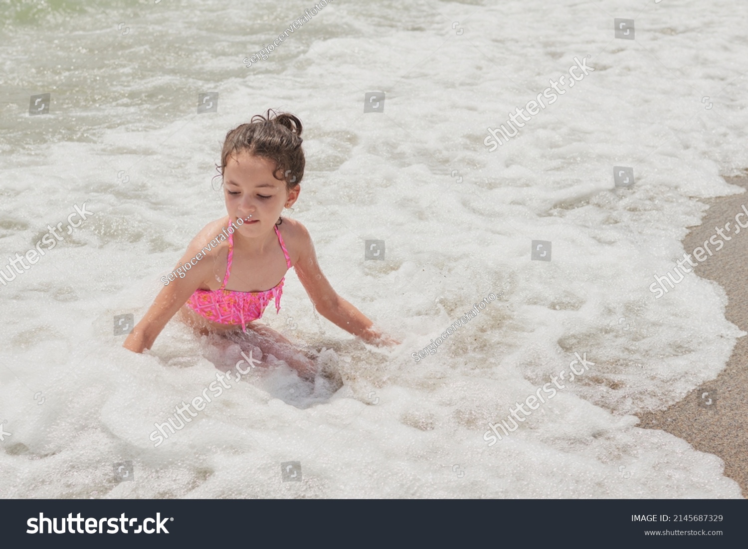 Girl Pink Bikini Playing Happily On Stock Photo 2145687329 Shutterstock