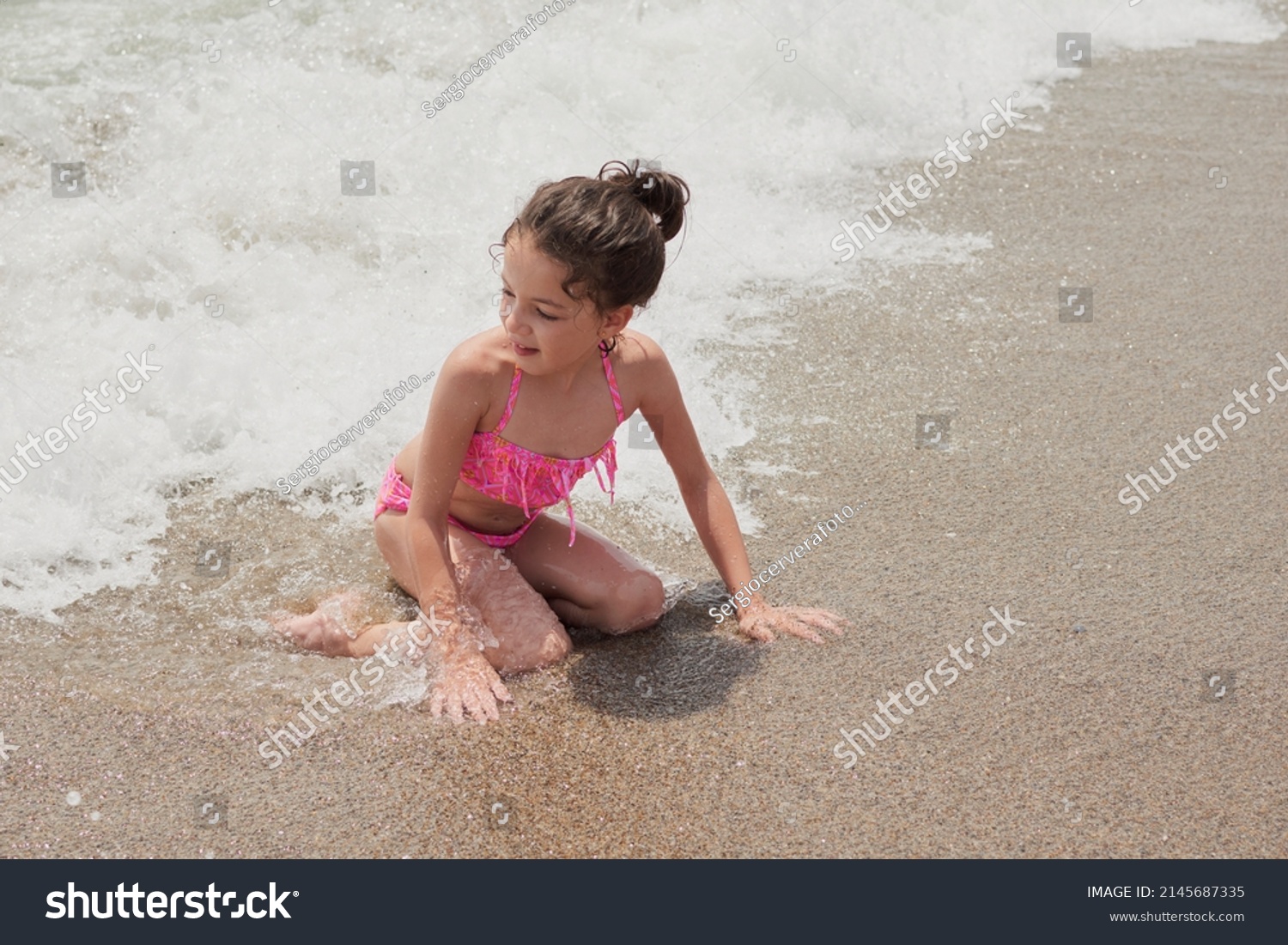 Girl Pink Bikini Playing Happily On Stock Photo 2145687335 Shutterstock