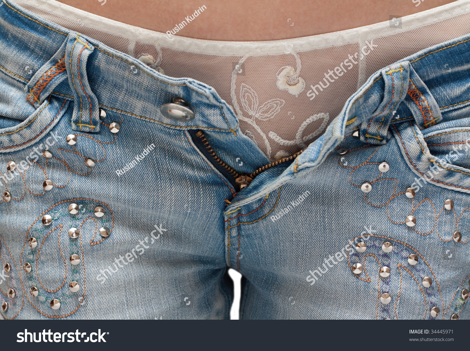 http://image.shutterstock.com/z/stock-photo-girl-in-white-panties-and-jeans-in-with-open-by-fly-34445971.jpg