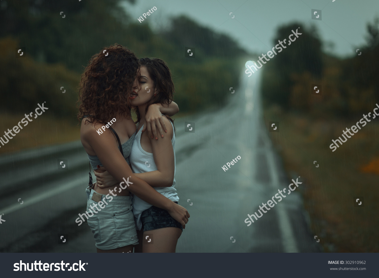 Girls Lesbians Kissing Under Heavy Rain Stock Photo 302910962