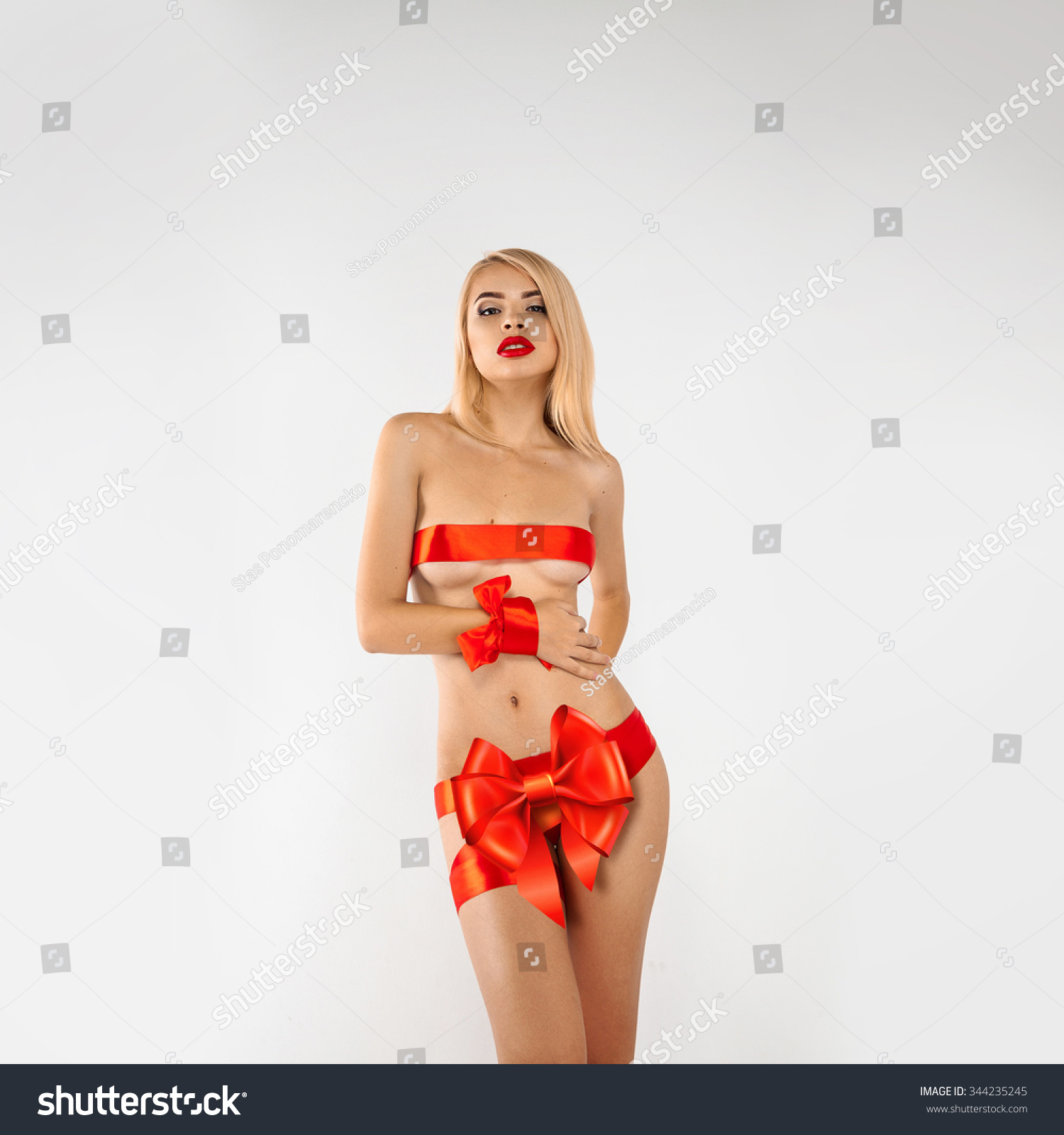 Glamour Woman Gift With Red Ribbons On Sexual Body Studio Shot Square Photo