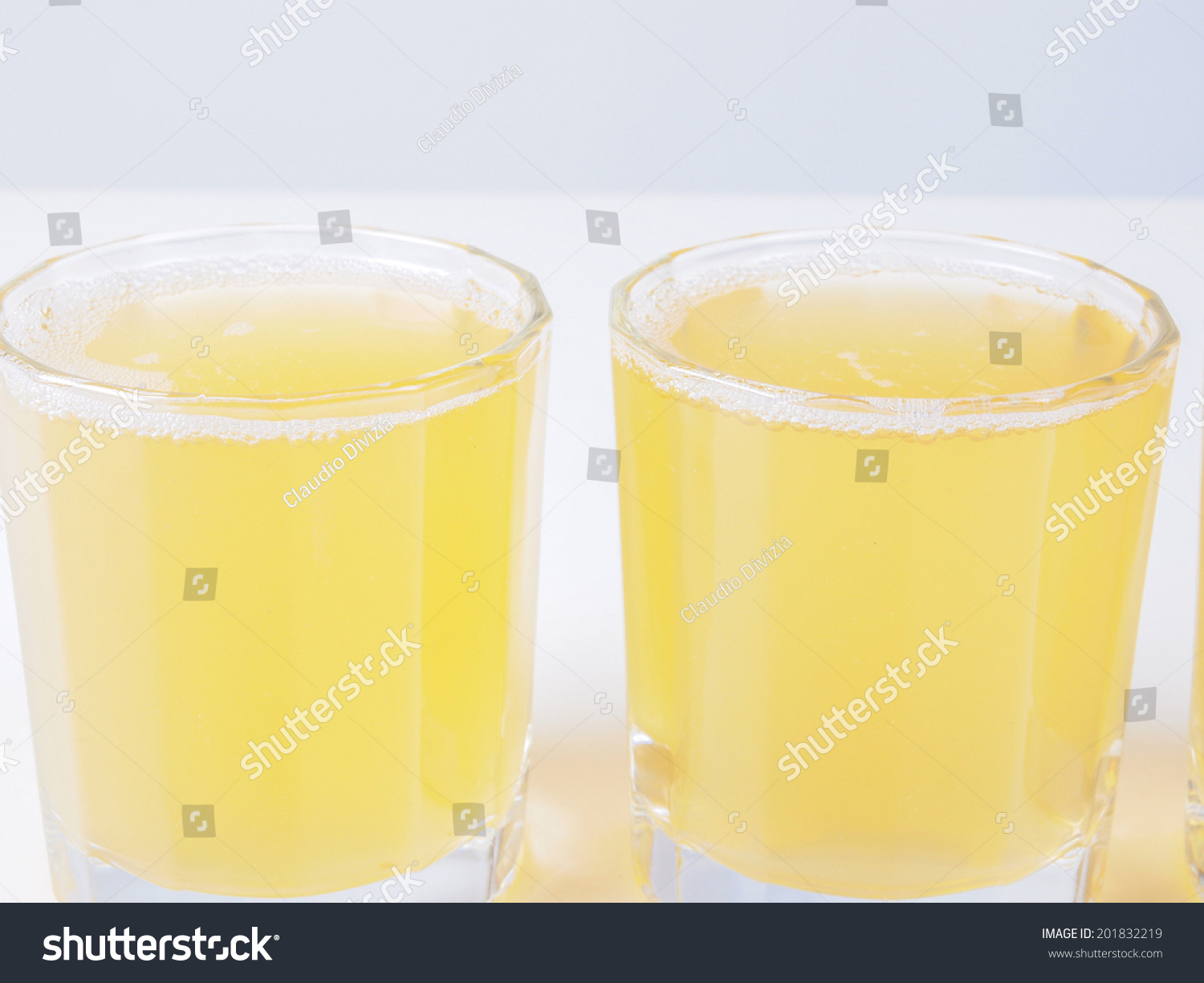 Glasses of pineapple juice on continental breakfast table Glasses of pineapple juice on continental breakfast table
