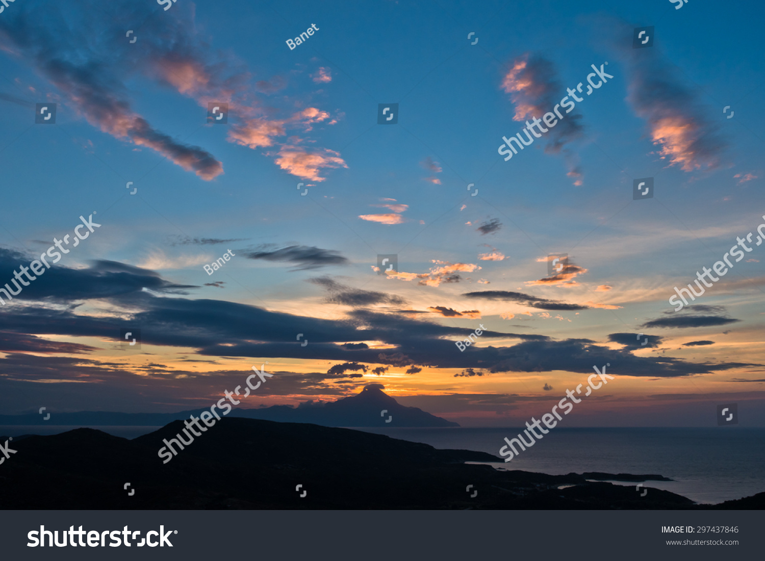 Greek coast of aegean sea at sunrise near holy mountain Athos Chalkidiki Greece Greek coast of aegean sea at sunrise near holy mountain Athos Chalkidiki Greece