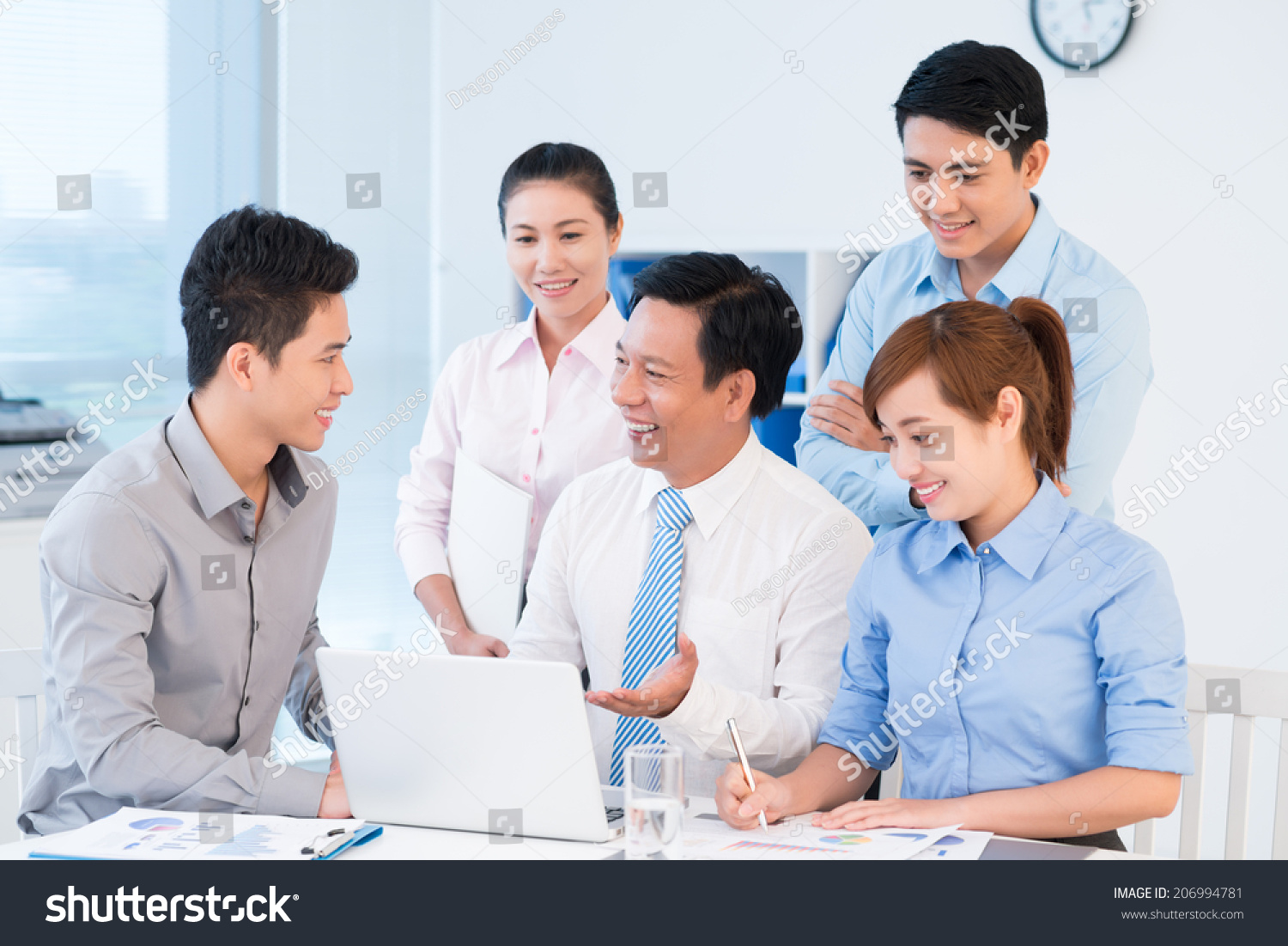 Group Of Business People Discussing Project In The Office Meeting