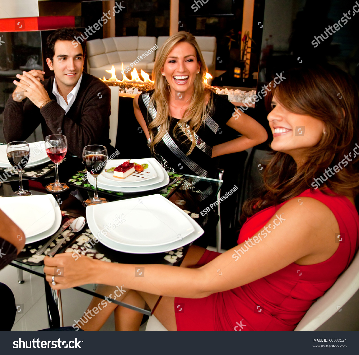 Group Of Friends Having Dinner In A Nice Restaurant Stock Photo