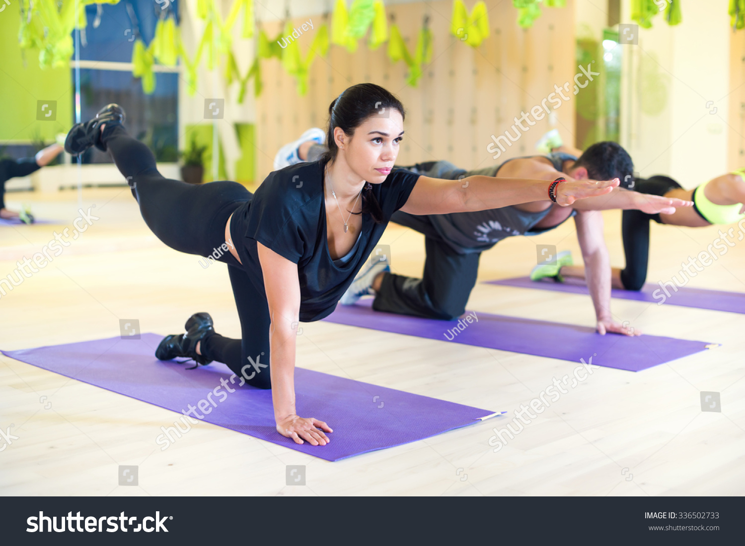 Group women stretching traning exercising in gym practicing yoga pilates Group women stretching traning exercising in gym practicing yoga pilates