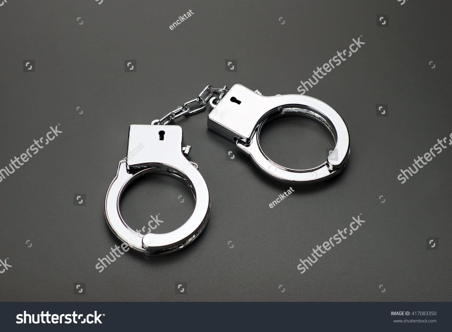 Handcuffs Isolated On Dark Background Stock Photo 417083350 : Shutterstock