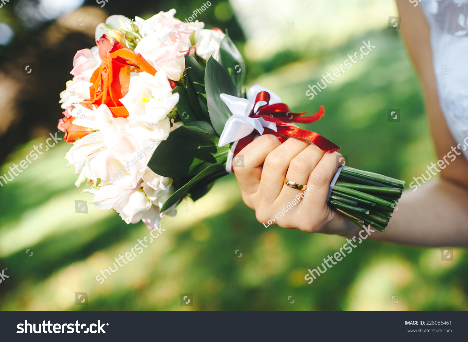 Hands and rings on wedding bouquet Hands and rings on wedding bouquet