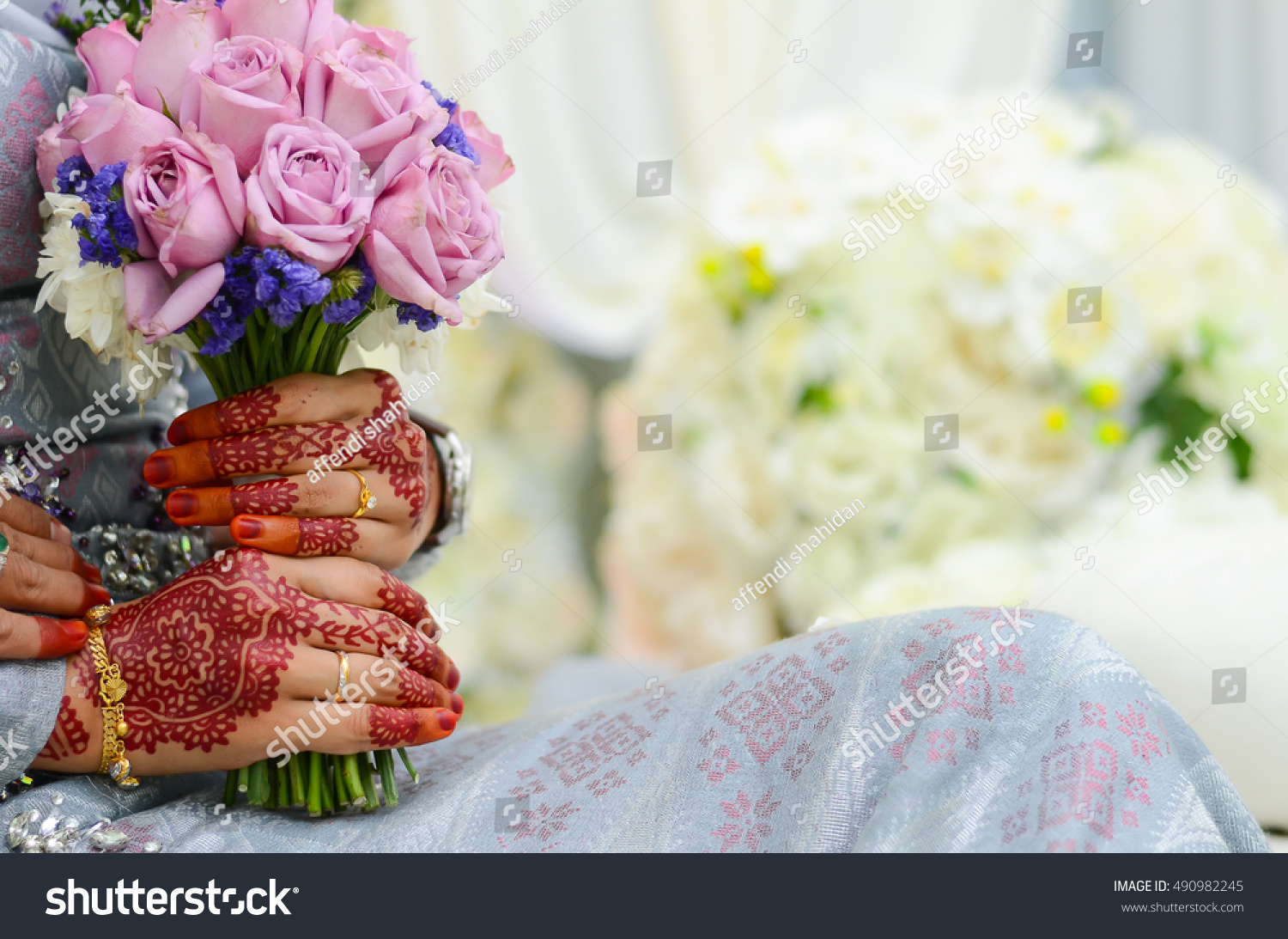 Hands of Bride With Flower bouquet Malay Wedding Dress And Bouquet Of Flowers Selective Focus And Shallow DOF Hands of Bride With Flower bouquet Malay Wedding Dress And Bouquet Of Flowers Selective Focus And Shallow DOF