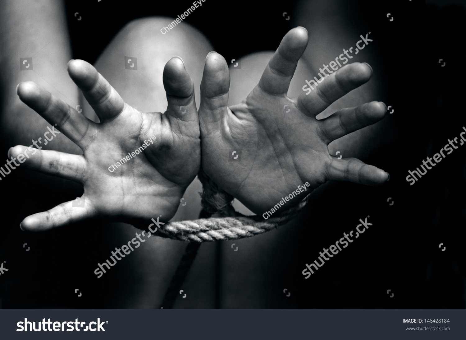 Hands Tied Up With Rope Of A Missing Kidnapped Abused H