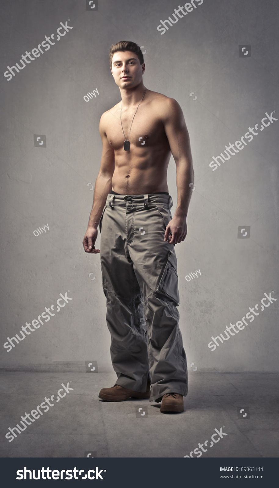 Bare-Chested Young Man Drawing A Bow Stock Photo 104465726 