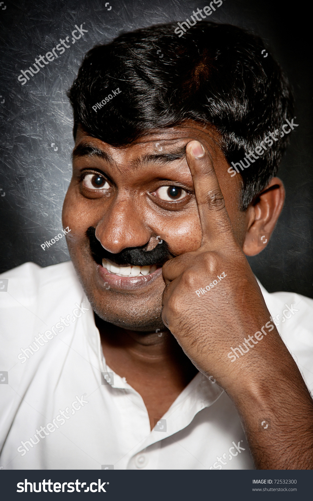 Handsome Indian Man With Moustache And Raise Eyebrow Smiling And Looking At Camera Close Up 0470