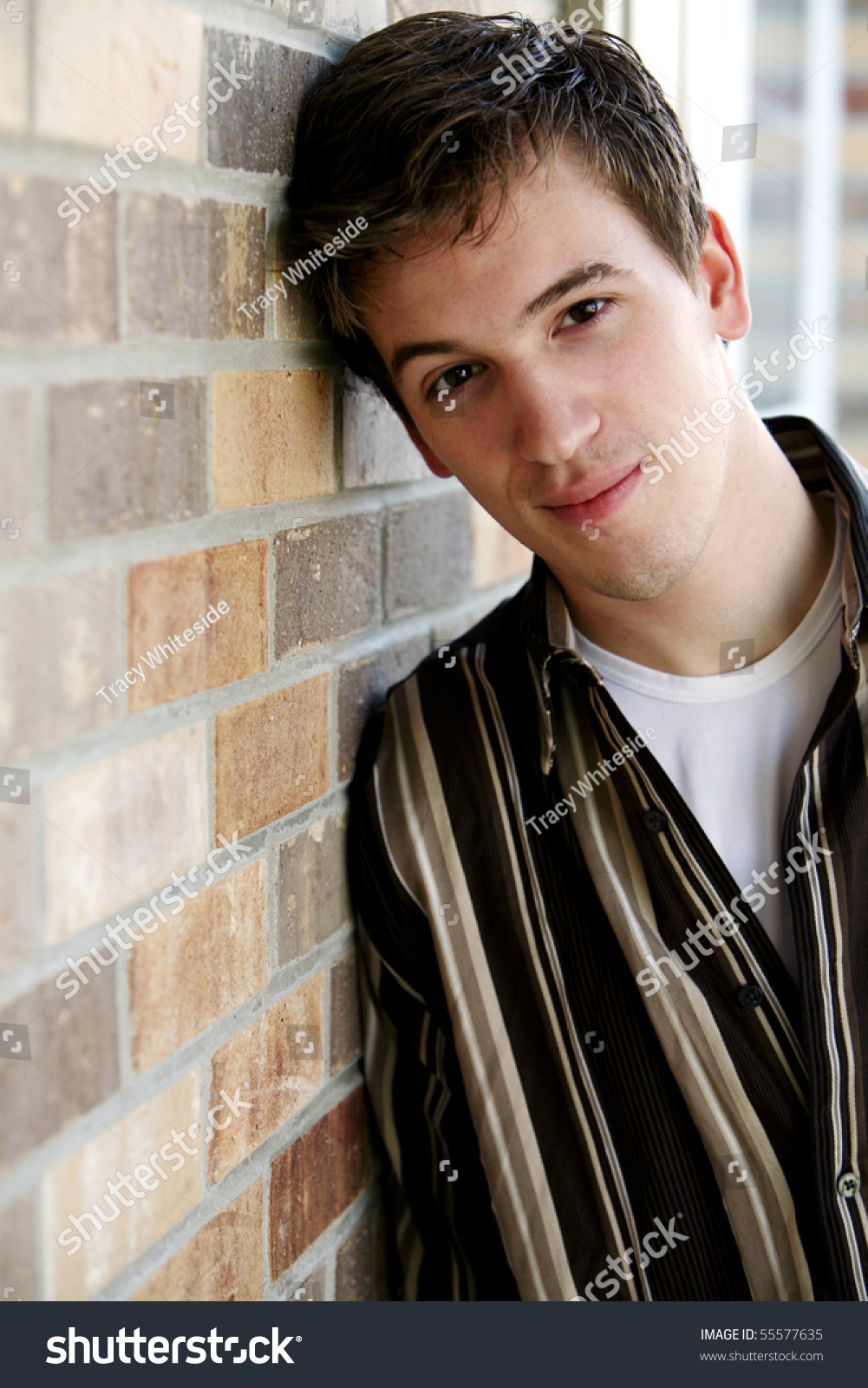 Save to a lightbox - stock-photo-handsome-teen-boy-by-brick-wall-55577635