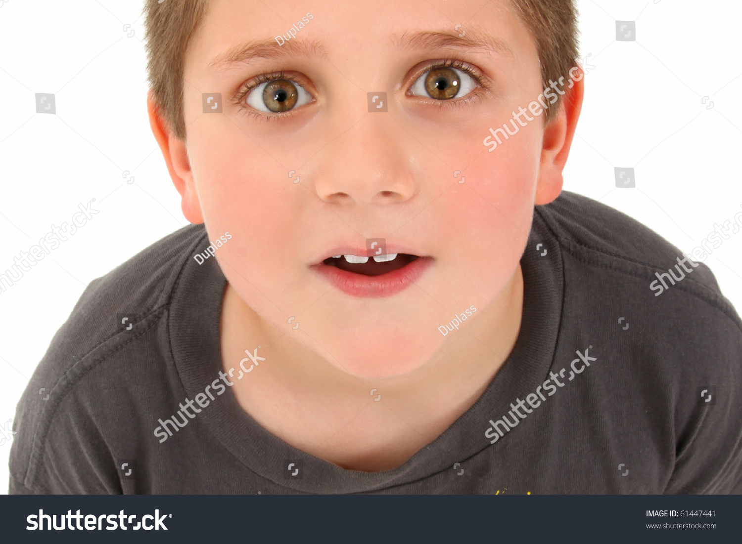 handsome-8-year-old-boy-looking-up-to-camera-stock-photo-61447441