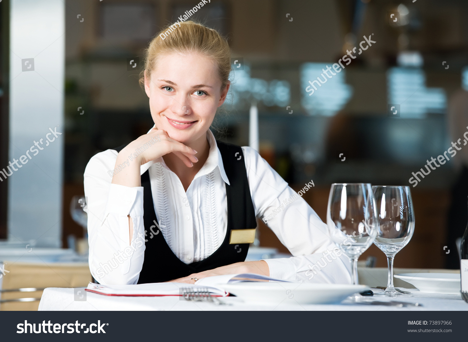 http://image.shutterstock.com/z/stock-photo-happy-beautiful-restaurant-manager-woman-administrator-at-work-place-73897966.jpg